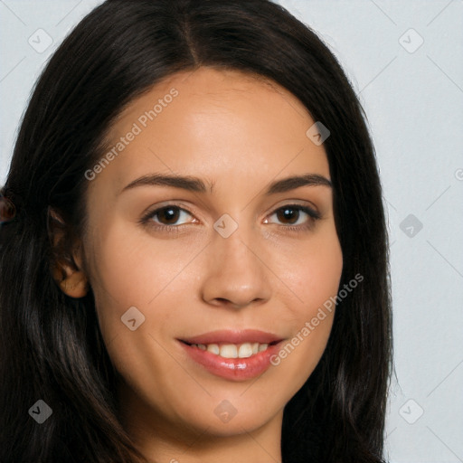 Joyful latino young-adult female with long  brown hair and brown eyes