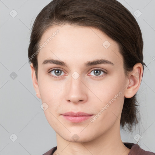 Neutral white young-adult female with short  brown hair and grey eyes