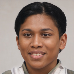 Joyful latino young-adult female with short  black hair and brown eyes