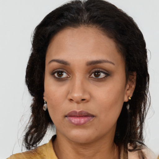 Neutral black young-adult female with long  brown hair and brown eyes