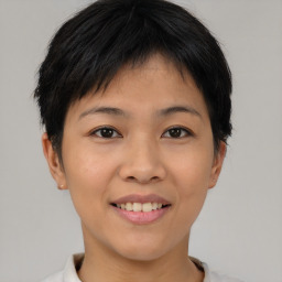 Joyful asian young-adult female with short  brown hair and brown eyes