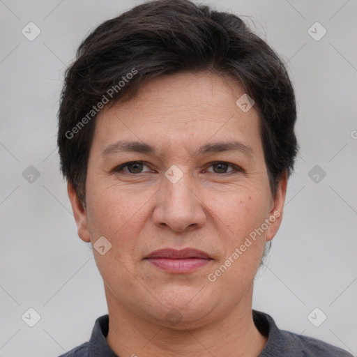 Joyful white adult female with short  brown hair and brown eyes