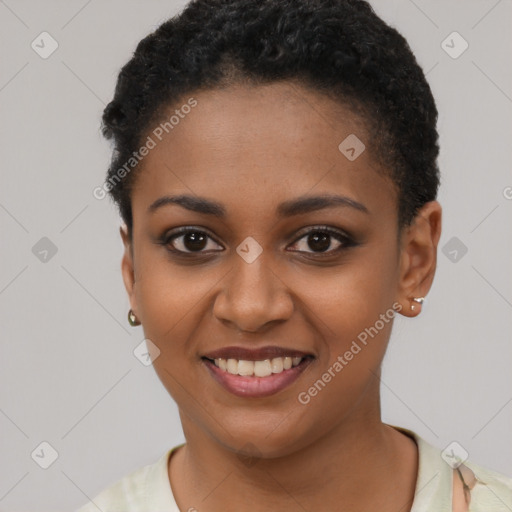 Joyful black young-adult female with short  brown hair and brown eyes