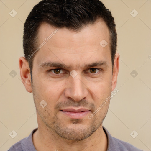 Joyful white adult male with short  brown hair and brown eyes