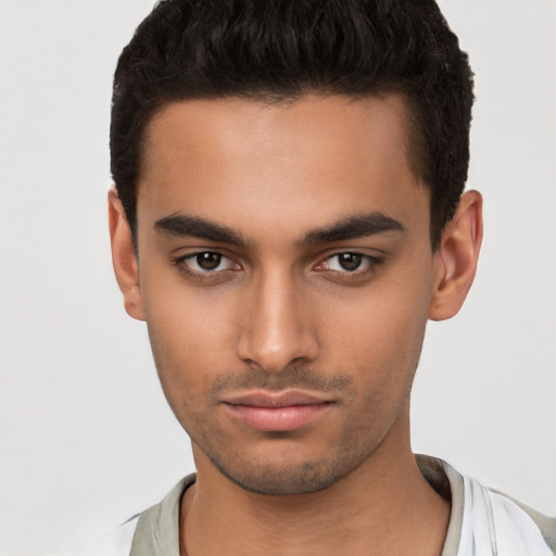 Neutral latino young-adult male with short  black hair and brown eyes