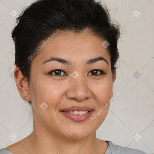 Joyful latino young-adult female with short  brown hair and brown eyes