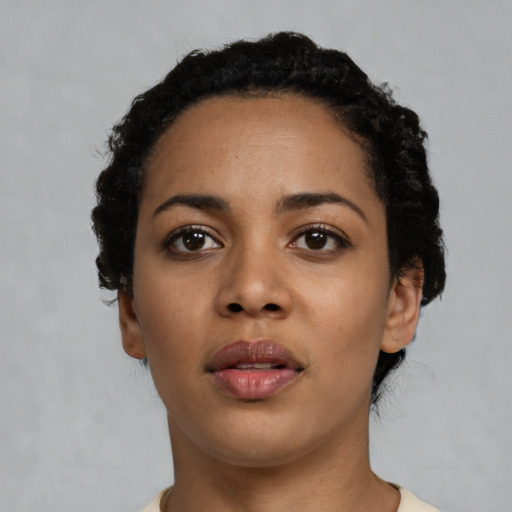Neutral latino young-adult female with short  black hair and brown eyes