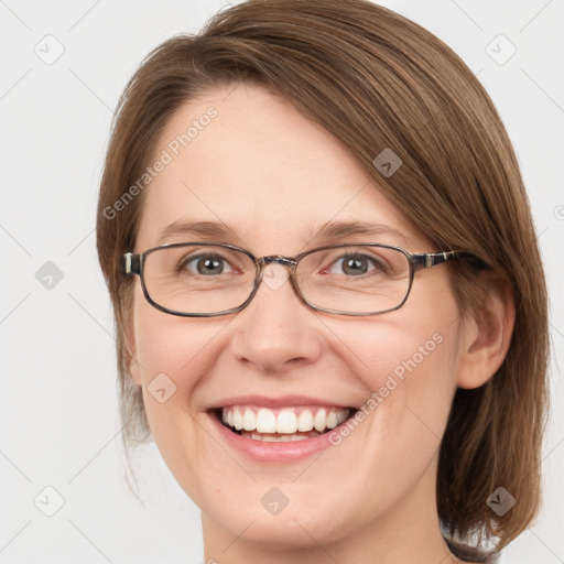 Joyful white adult female with medium  brown hair and blue eyes