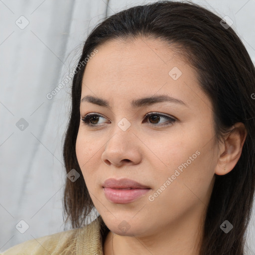 Joyful asian young-adult female with long  brown hair and brown eyes