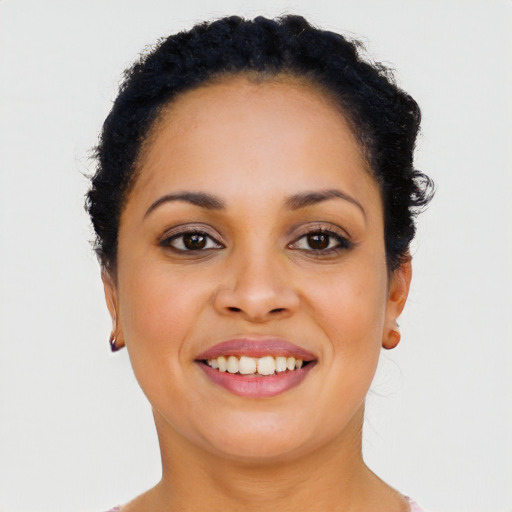 Joyful latino young-adult female with long  black hair and brown eyes