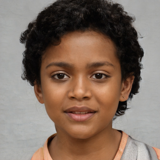 Joyful black child female with short  black hair and brown eyes