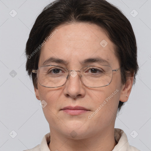 Joyful white adult female with short  brown hair and brown eyes