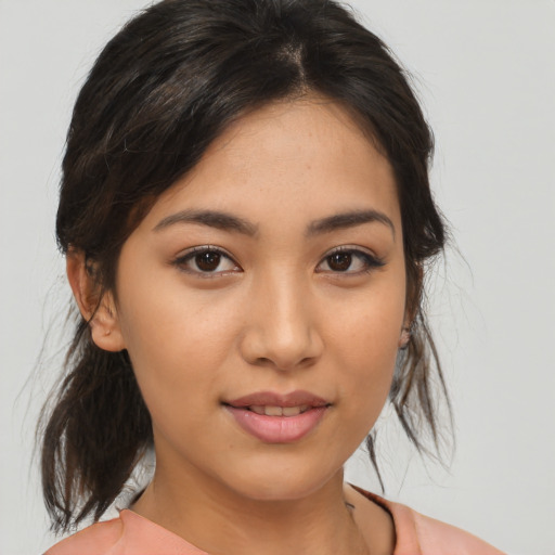 Joyful asian young-adult female with medium  brown hair and brown eyes