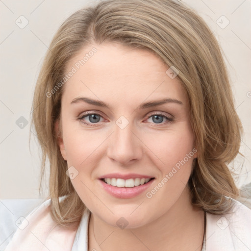 Joyful white young-adult female with medium  brown hair and blue eyes