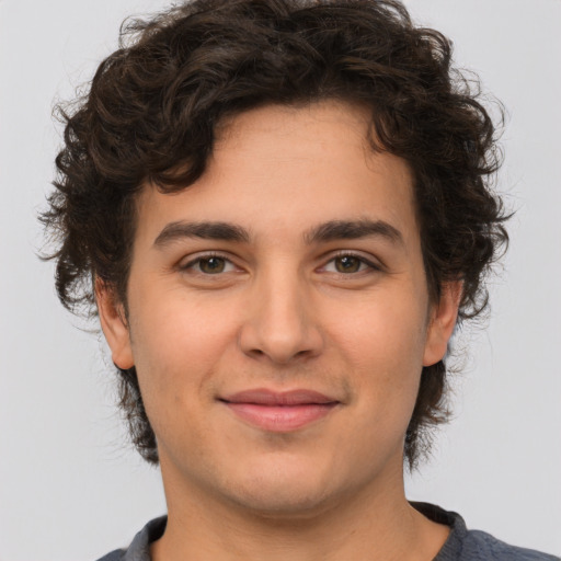 Joyful white young-adult male with medium  brown hair and brown eyes