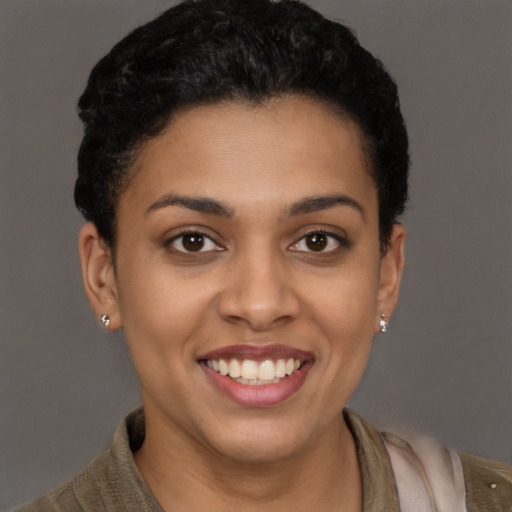 Joyful latino young-adult female with short  brown hair and brown eyes