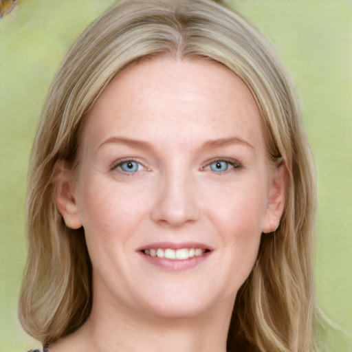 Joyful white young-adult female with medium  brown hair and blue eyes