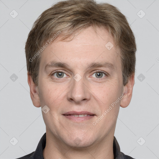 Joyful white adult male with short  brown hair and grey eyes