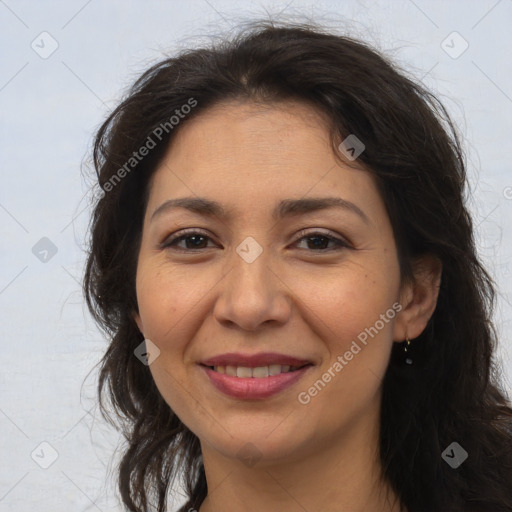 Joyful white adult female with long  brown hair and brown eyes