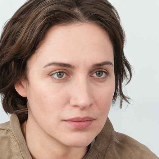 Neutral white young-adult female with medium  brown hair and grey eyes