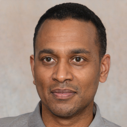 Neutral latino adult male with short  black hair and brown eyes