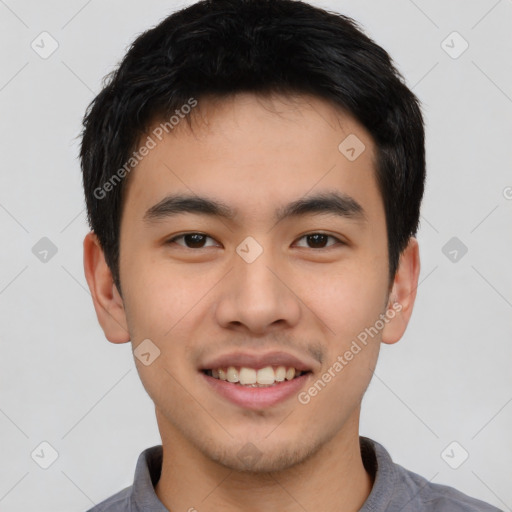 Joyful asian young-adult male with short  black hair and brown eyes