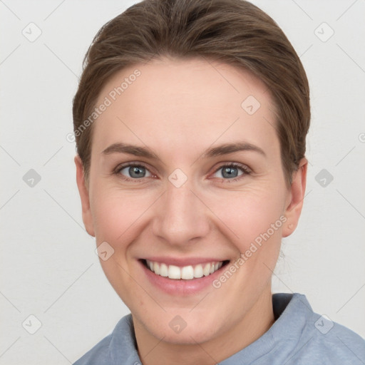 Joyful white young-adult female with short  brown hair and grey eyes