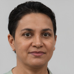 Joyful white adult female with short  brown hair and brown eyes