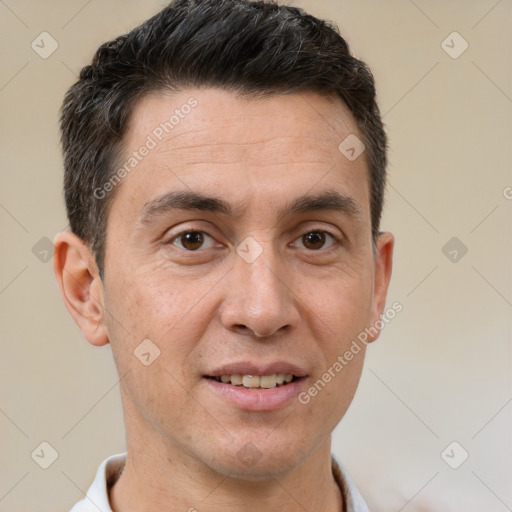 Joyful white adult male with short  brown hair and brown eyes