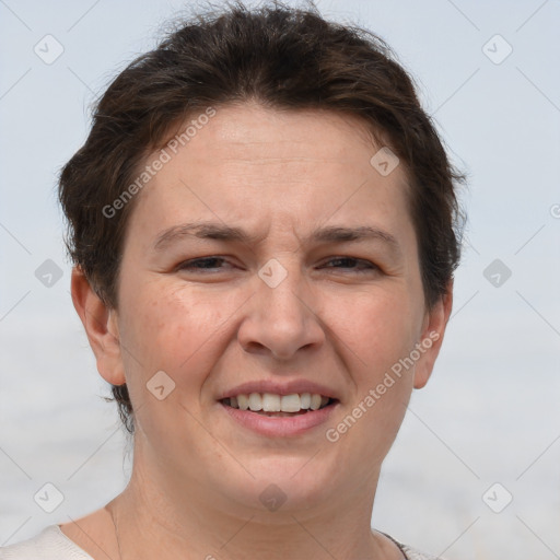 Joyful white adult female with short  brown hair and brown eyes