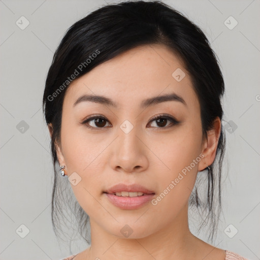 Joyful asian young-adult female with medium  black hair and brown eyes