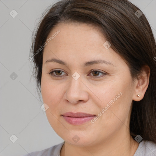 Joyful white adult female with medium  brown hair and brown eyes