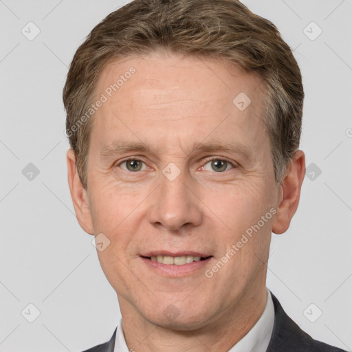 Joyful white adult male with short  brown hair and grey eyes