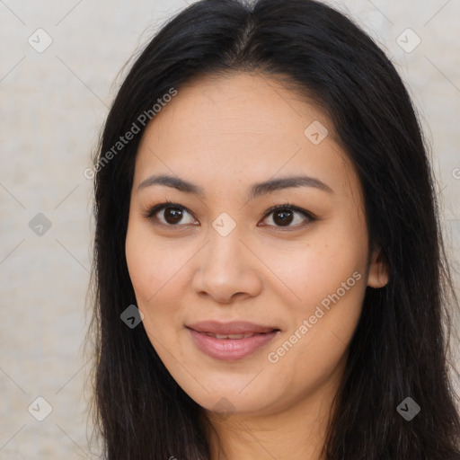 Joyful asian young-adult female with long  brown hair and brown eyes