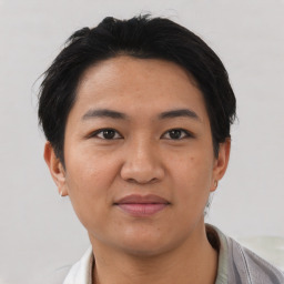 Joyful asian young-adult female with short  black hair and brown eyes