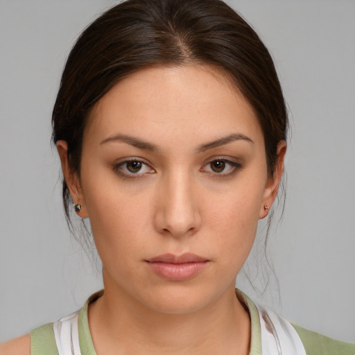 Neutral white young-adult female with medium  brown hair and brown eyes