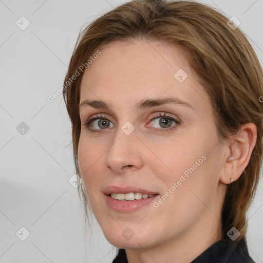 Joyful white young-adult female with medium  brown hair and blue eyes