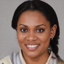 Joyful black young-adult female with medium  brown hair and brown eyes