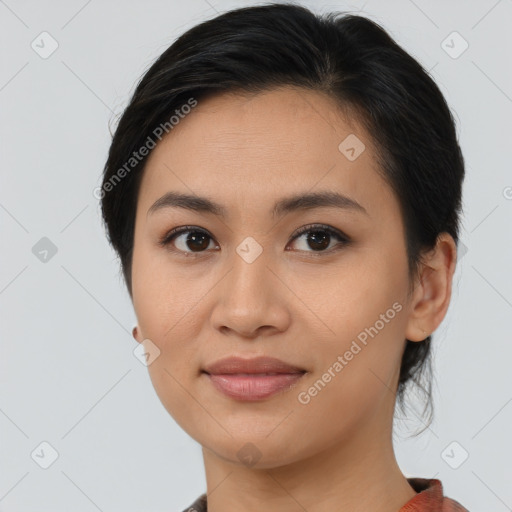 Joyful asian young-adult female with medium  brown hair and brown eyes