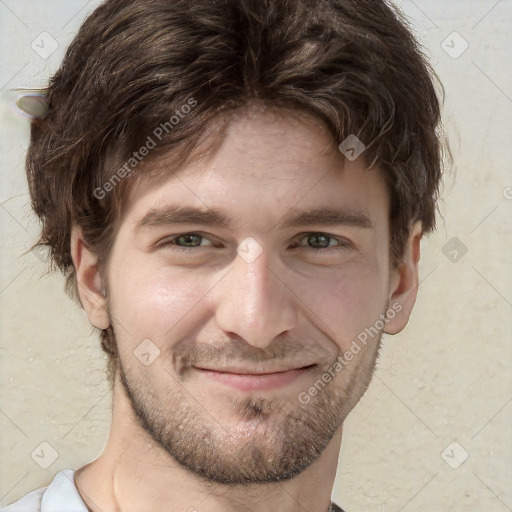 Joyful white young-adult male with short  brown hair and green eyes