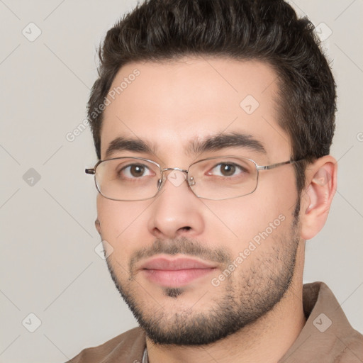 Neutral white young-adult male with short  brown hair and brown eyes