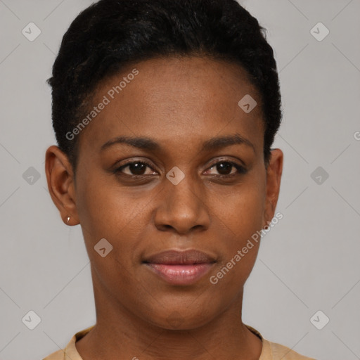 Joyful black young-adult female with short  black hair and brown eyes