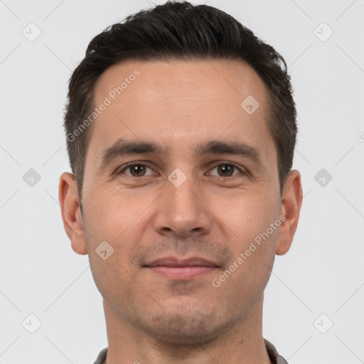 Joyful white young-adult male with short  brown hair and brown eyes