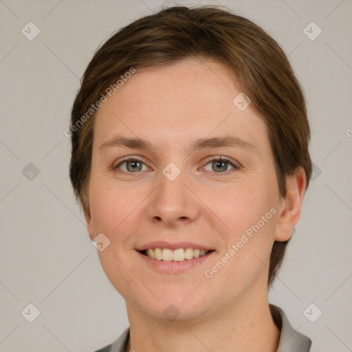 Joyful white young-adult female with short  brown hair and grey eyes