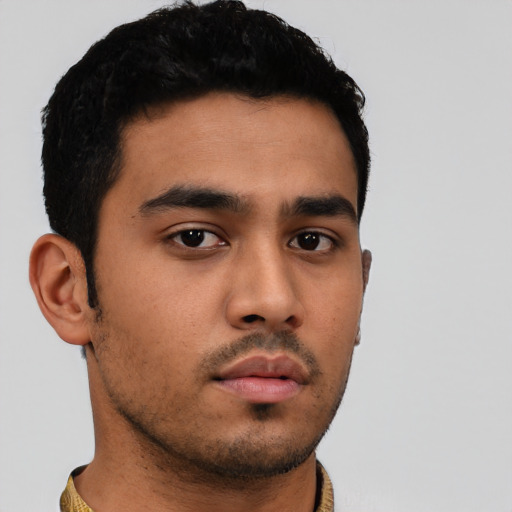 Neutral latino young-adult male with short  black hair and brown eyes