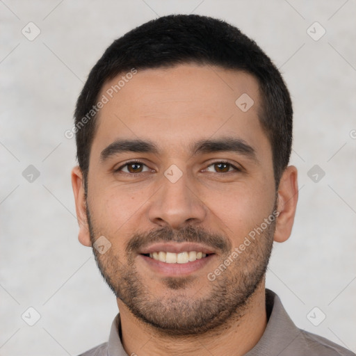 Joyful white young-adult male with short  black hair and brown eyes