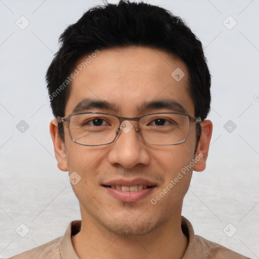 Joyful asian young-adult male with short  brown hair and brown eyes