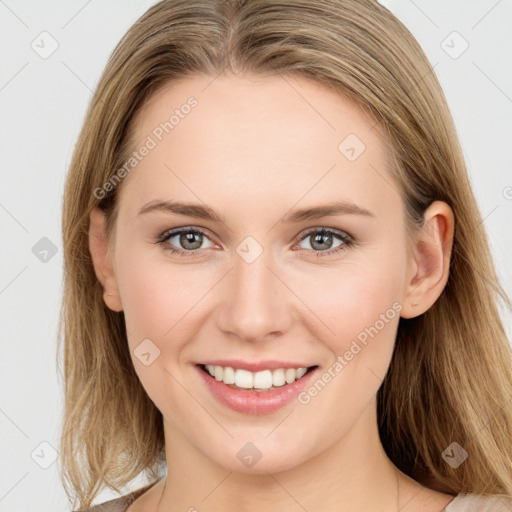 Joyful white young-adult female with long  brown hair and blue eyes