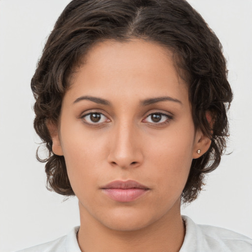 Neutral white young-adult female with medium  brown hair and brown eyes