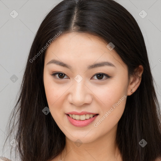 Joyful asian young-adult female with long  brown hair and brown eyes